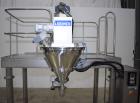 Used Leepack Servo Drive Powder Auger Feeder, Model AW-590IV. Mitsubishi model MR-JZS-200A servo drive. Foot pedal switch. Level sensor. Mounted on stainless steel frame with casters. 3/60/480 Volt.